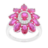 Oval pink sapphire and diamond halo sterling silver ring, elegant flower design for a luxurious look.